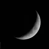 The Crescent Moon In The Night Sky.